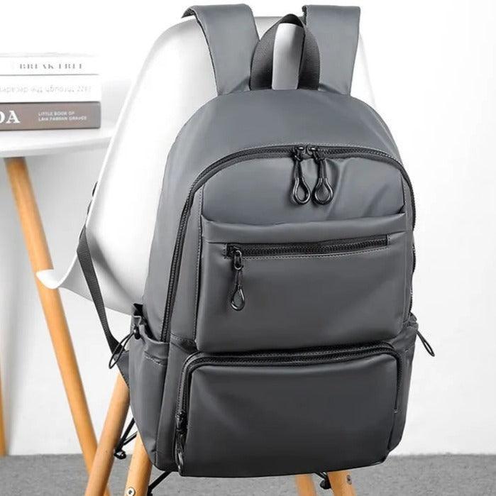Mochila para hombre de tela Oxford impermeable, color gris, con varios bolsillos.